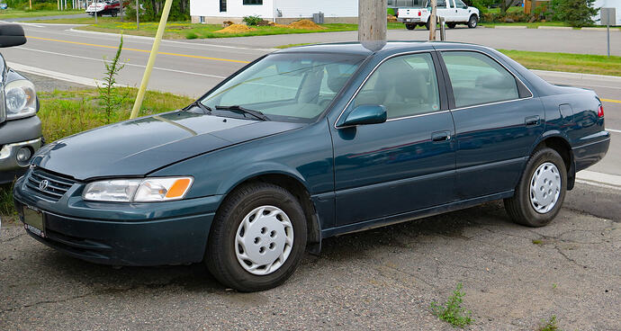 1998_Toyota_Camry_LE_in_Classic_Green_Pearl,_Front_Left,_08-12-2023
